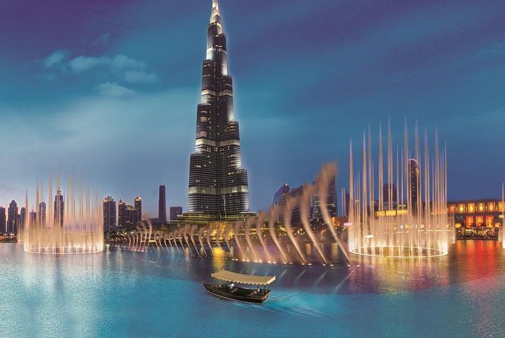 A stunning display of light and water unfolds against the iconic Burj Khalifa inviting travelers to experience an unforgettable evening in the heart of Dubai's modern marvels.